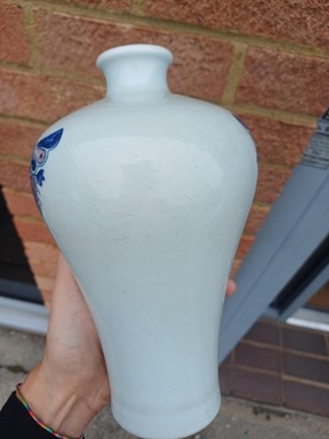 Lot 83 - A Chinese blue and white and copper-red 'butterfly' vase, 19th / 20th century