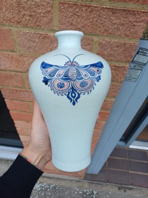 Lot 83 - A Chinese blue and white and copper-red 'butterfly' vase, 19th / 20th century
