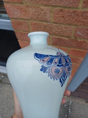 Lot 83 - A Chinese blue and white and copper-red 'butterfly' vase, 19th / 20th century