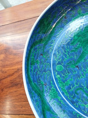 Lot 342 - A Chinese green-enamelled 'dragon' dish, late Qing dynasty, Kangxi mark