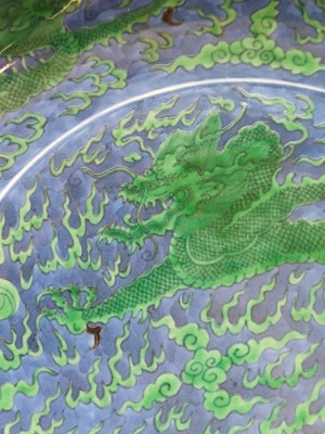 Lot 342 - A Chinese green-enamelled 'dragon' dish, late Qing dynasty, Kangxi mark