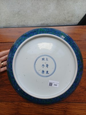 Lot 342 - A Chinese green-enamelled 'dragon' dish, late Qing dynasty, Kangxi mark