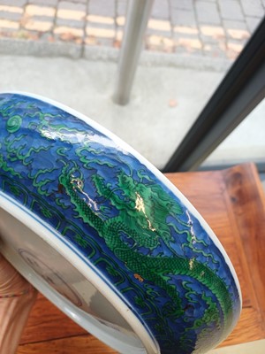 Lot 342 - A Chinese green-enamelled 'dragon' dish, late Qing dynasty, Kangxi mark