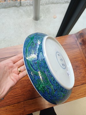 Lot 342 - A Chinese green-enamelled 'dragon' dish, late Qing dynasty, Kangxi mark