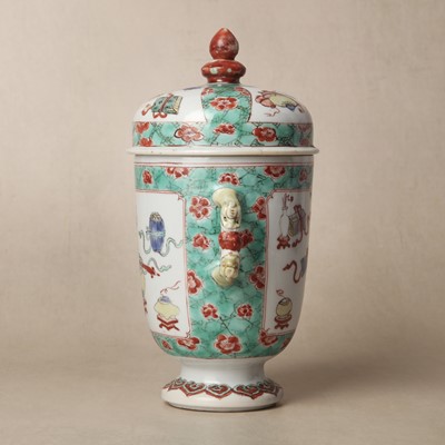 Lot 26 - A Chinese famille-verte twin-handled 'hundred antiques' pot and cover, Qing Dynasty, Kangxi period