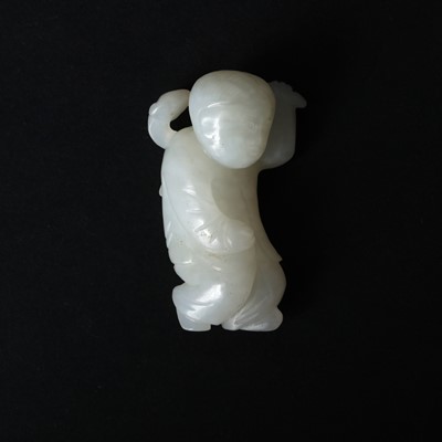Lot 104 - A Chinese white jade carving of a boy, 20th century