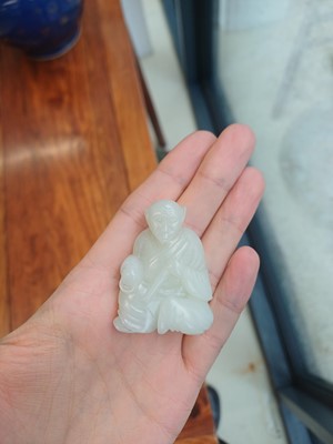 Lot 89 - A Chinese pale celadon jade 'zodiac' carving, Qing dynasty