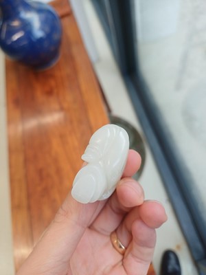Lot 89 - A Chinese pale celadon jade 'zodiac' carving, Qing dynasty