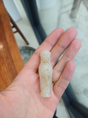 Lot 90 - A Chinese celadon jade 'Dragon King' carving, Qing dynasty, 19th century