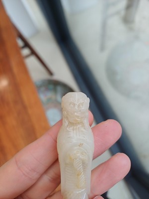 Lot 90 - A Chinese celadon jade 'Dragon King' carving, Qing dynasty, 19th century