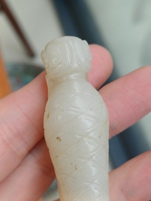 Lot 90 - A Chinese celadon jade 'Dragon King' carving, Qing dynasty, 19th century