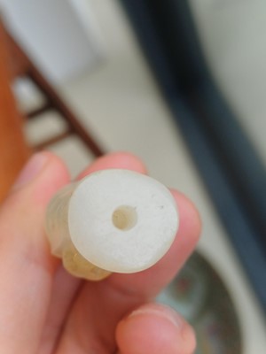 Lot 90 - A Chinese celadon jade 'Dragon King' carving, Qing dynasty, 19th century