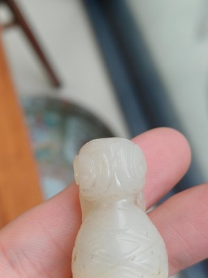 Lot 90 - A Chinese celadon jade 'Dragon King' carving, Qing dynasty, 19th century