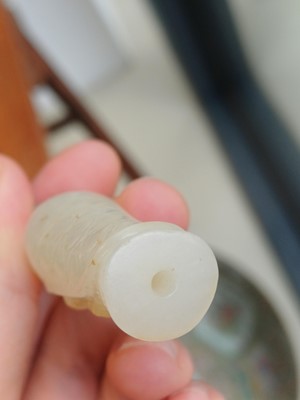 Lot 90 - A Chinese celadon jade 'Dragon King' carving, Qing dynasty, 19th century