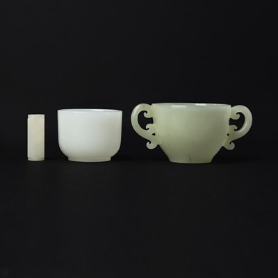 Lot 101 - Two small Chinese jade cups and a cong, 20th century