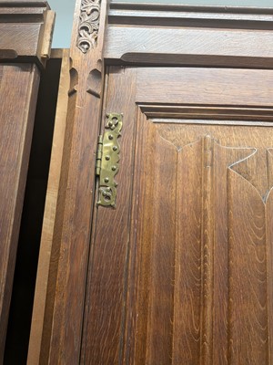 Lot 65 - A Pugin style ecclesiastical four door oak linen cupboard