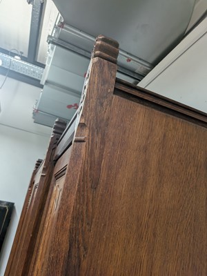 Lot 65 - A Pugin style ecclesiastical four door oak linen cupboard
