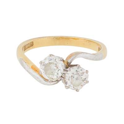 Lot 226 - A diamond two stone crossover ring, circa 1976