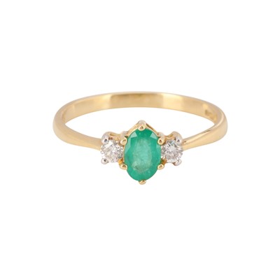 Lot 62 - An emerald and diamond three stone ring