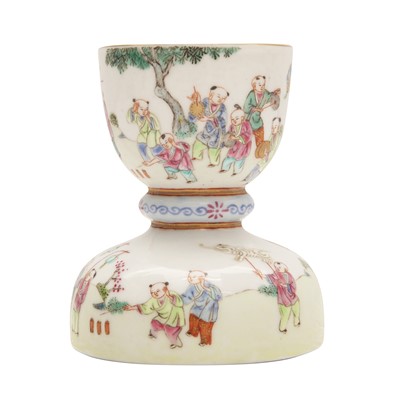 Lot 617 - A Chinese famille-rose 'boys' candlestick, 20th century