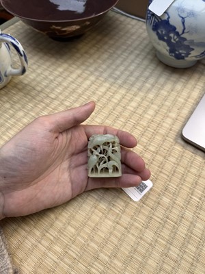 Lot 80 - A Chinese reticulated celadon jade 'egret' finial, Yuan/Ming dynasty