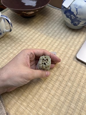 Lot 80 - A Chinese reticulated celadon jade 'egret' finial, Yuan/Ming dynasty