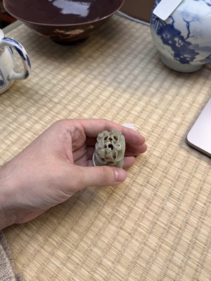 Lot 80 - A Chinese reticulated celadon jade 'egret' finial, Yuan/Ming dynasty