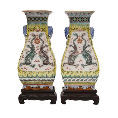 Lot 331 - A pair of Chinese yellow-ground 'dragons' vases, Qing dynasty, 19th century
