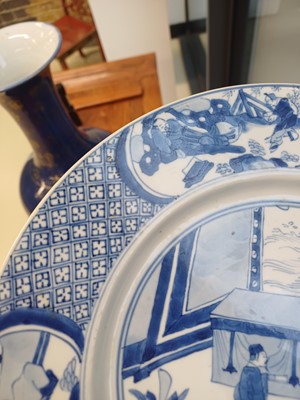 Lot 6 - A rare Chinese blue and white 'figural' dish, Qing dynasty, Kangxi period, 'BEVERE' mark