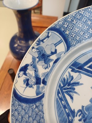 Lot 6 - A rare Chinese blue and white 'figural' dish, Qing dynasty, Kangxi period, 'BEVERE' mark