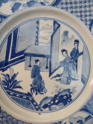 Lot 6 - A rare Chinese blue and white 'figural' dish, Qing dynasty, Kangxi period, 'BEVERE' mark