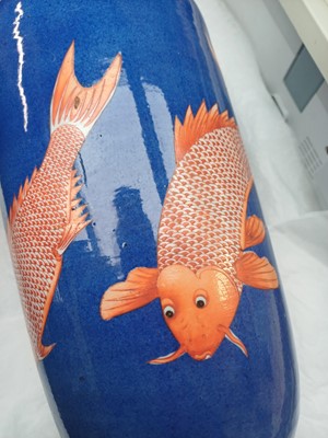 Lot 66 - A Chinese powder-blue iron-red 'carp' rouleau vase, Qing dynasty, Daoguang period