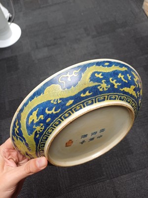 Lot 65 - A rare Chinese yellow-enamelled blue-ground 'dragon' dish, Qing dynasty, Daoguang period