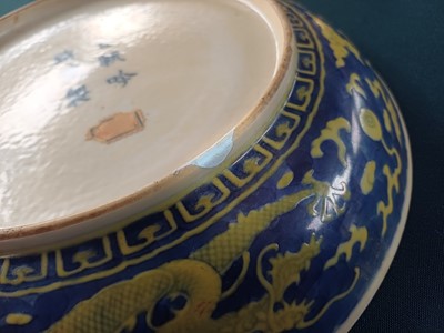 Lot 65 - A rare Chinese yellow-enamelled blue-ground 'dragon' dish, Qing dynasty, Daoguang period