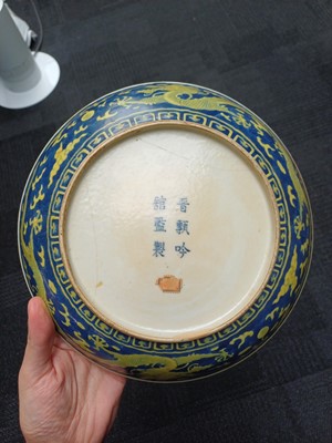 Lot 65 - A rare Chinese yellow-enamelled blue-ground 'dragon' dish, Qing dynasty, Daoguang period