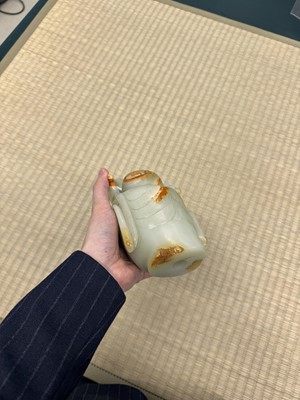 Lot 88 - A large Chinese celadon jade bust of Guanyin, Qing dynasty, 18th/19th century