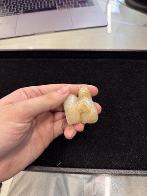 Lot 79 - A Chinese celadon jade 'horses' carving, probably Liao / Jin dynasty