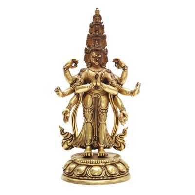 Lot 227 - A Sino-Tibetan gilt-bronze figure of Ekadasamukha Avalokiteshvara, Qing dynasty, 18th century
