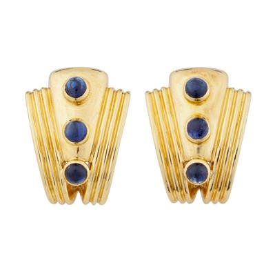 Lot 54 - A pair of yellow gold and blue sapphire half hoop earrings