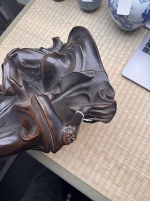 Lot 75 - A Chinese silver-inlaid bronze figure of a Luohan, late Qing dynasty