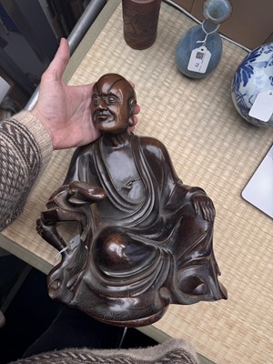 Lot 75 - A Chinese silver-inlaid bronze figure of a Luohan, late Qing dynasty