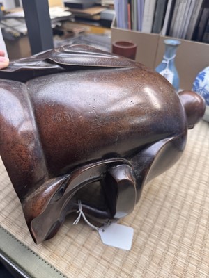 Lot 75 - A Chinese silver-inlaid bronze figure of a Luohan, late Qing dynasty