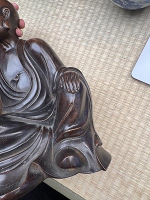 Lot 75 - A Chinese silver-inlaid bronze figure of a Luohan, late Qing dynasty