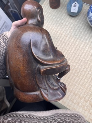 Lot 75 - A Chinese silver-inlaid bronze figure of a Luohan, late Qing dynasty