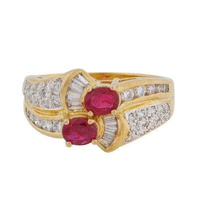 Lot 171 - A ruby and diamond crossover ring