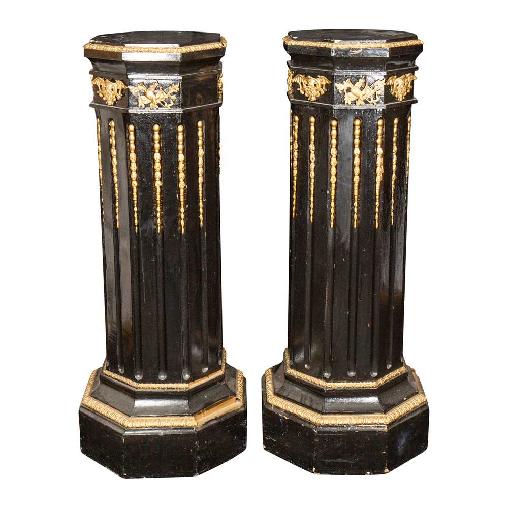 Lot 47 - A pair of Victorian gilt metal mounted ebonised octagonal columns