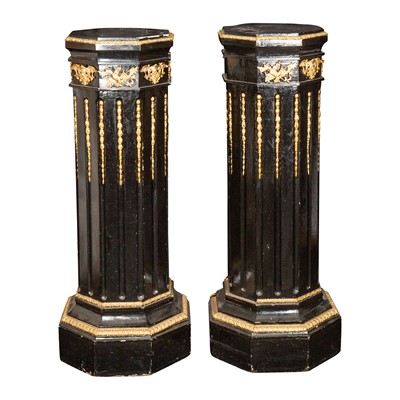 Lot 47 - A pair of Victorian gilt metal mounted ebonised octagonal columns