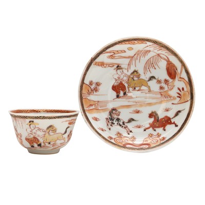 Lot 220 - A Chinese rouge-de-fer cup and saucer, Qing dynasty, 18th/19th century