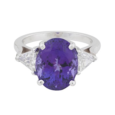 Lot 21 - A tanzanite and diamond three stone ring, circa 2006