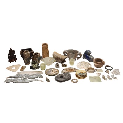 Lot 588 - A large group of Chinese archaistic jade and hardstone carvings, 20th century